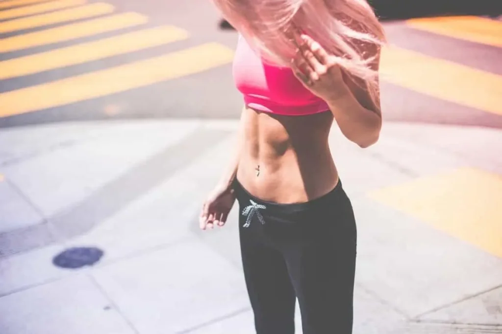 Woman with toned stomach after LA-EMS Body Sculpting Treatment Diss